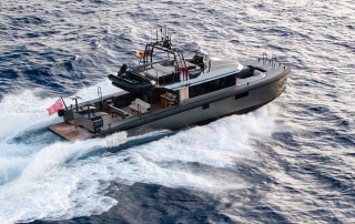 Vandal 60 chase boat voyaging at speed.