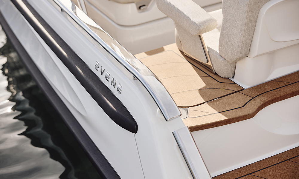 Close-up of Evene Tender’s cork decking and upholstered helm seat.