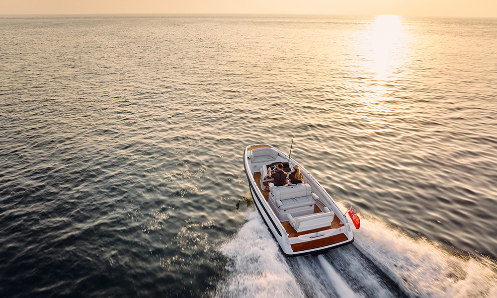 Evene Tender's Origin Series tender cruising at sunset with passengers on board.