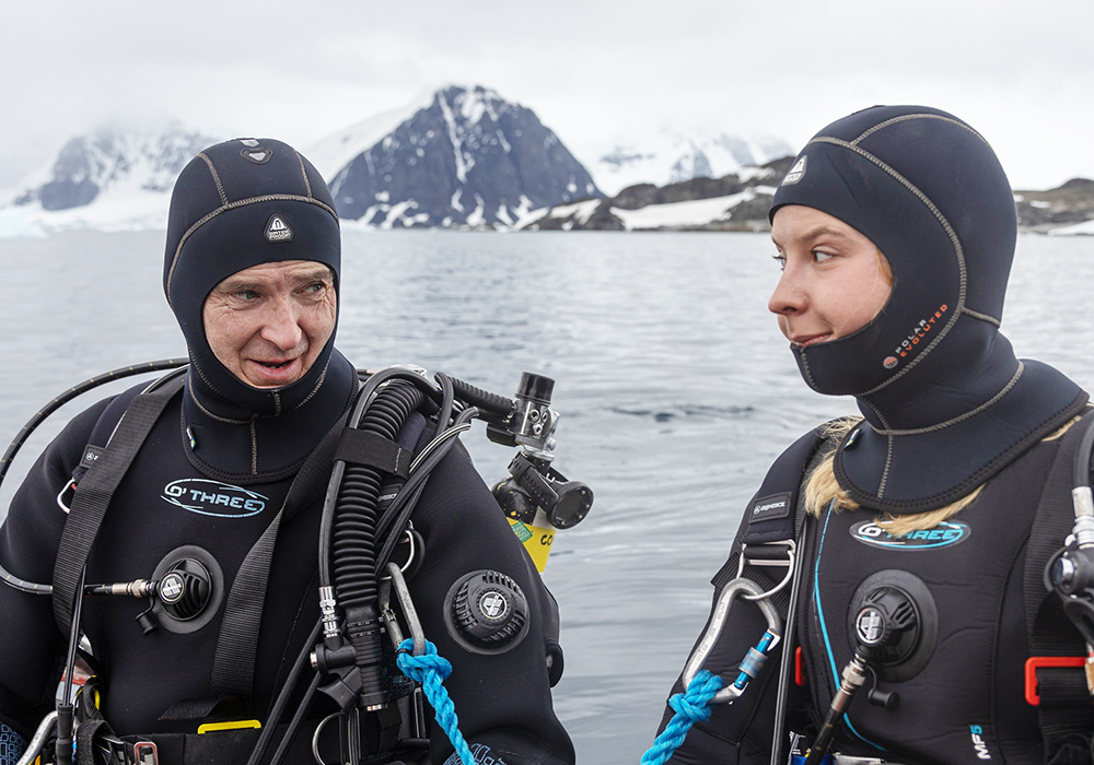 Two fully kitted divers