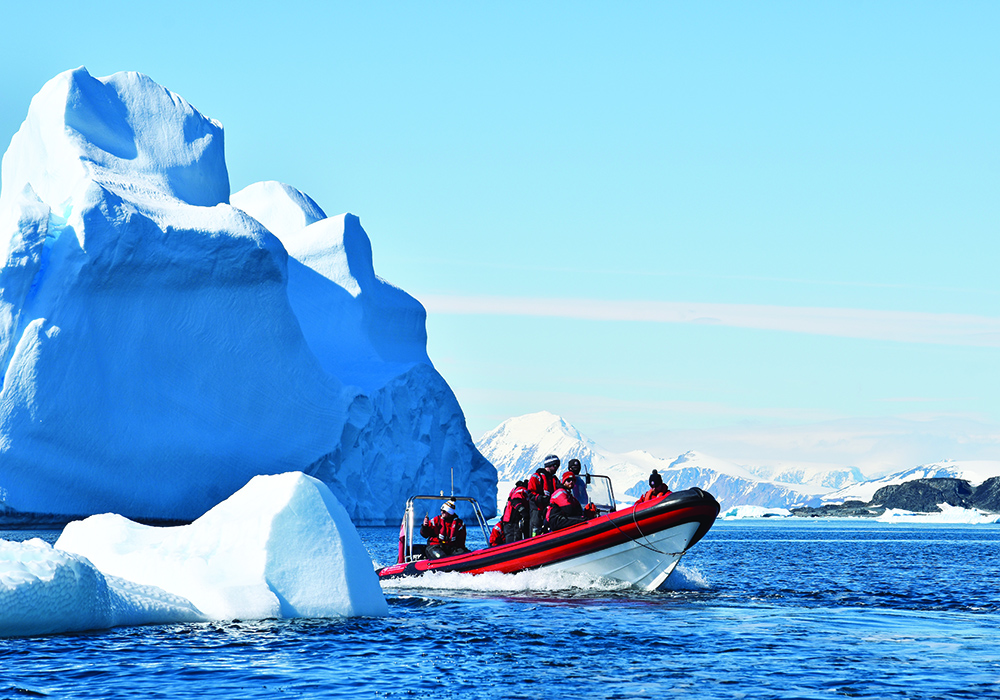 An Island RIB navigating between icebergs