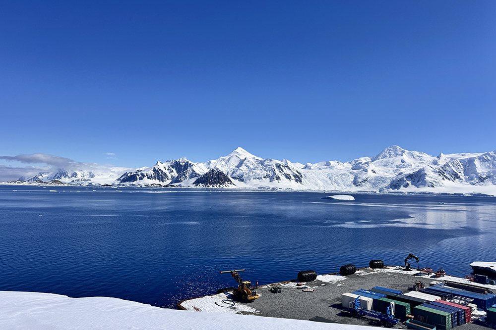 View across the water top ice topped mountains