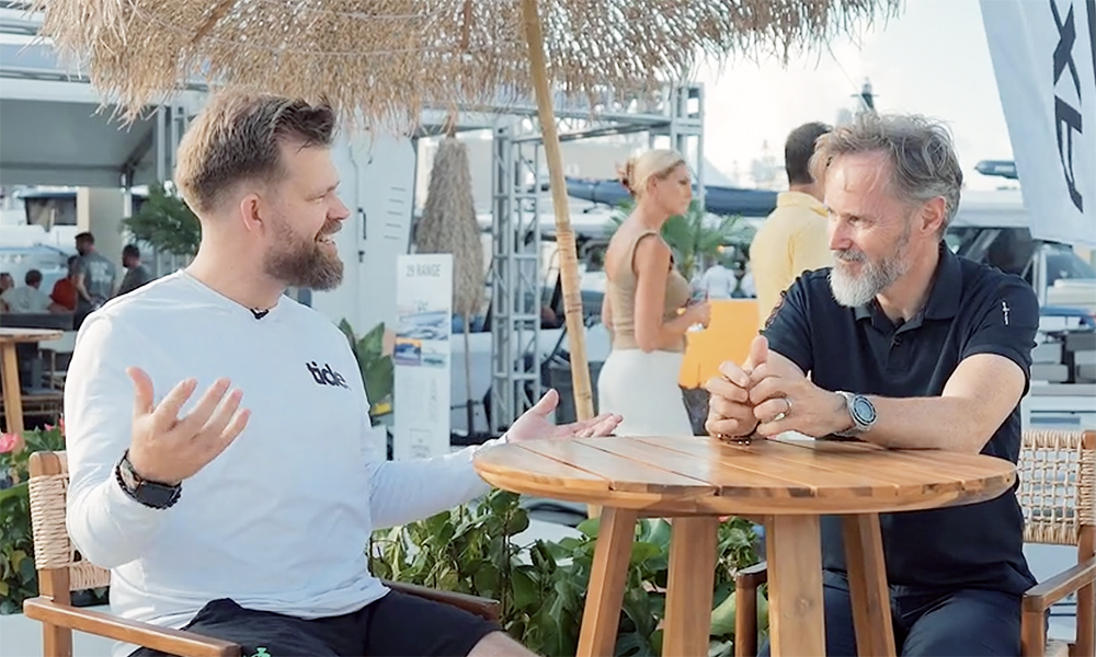 Two men sat at table chatting