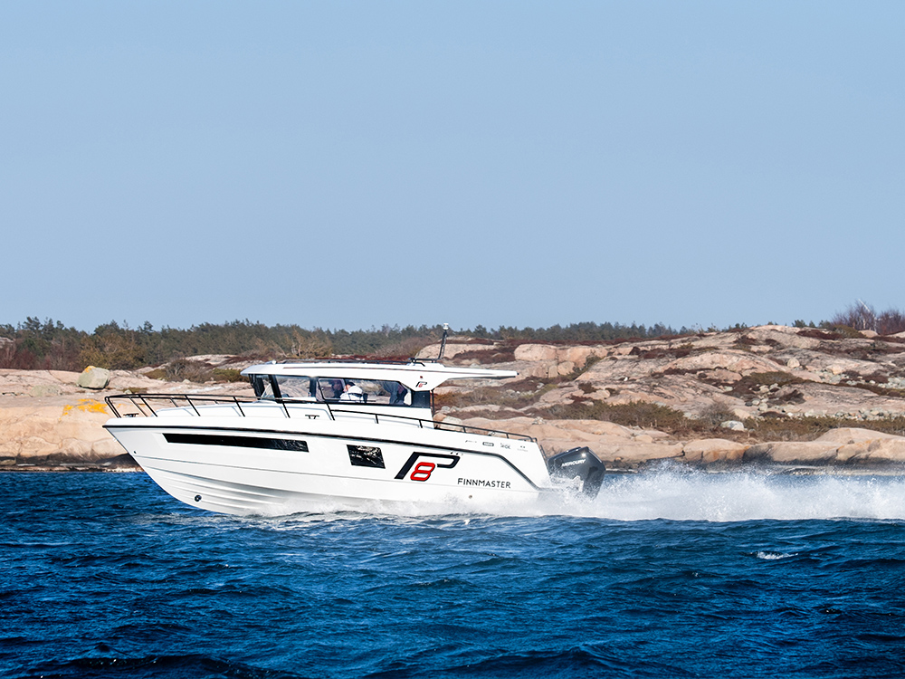 Finnmaster Pilot 8 outboard cruising at speed on coastal waters.