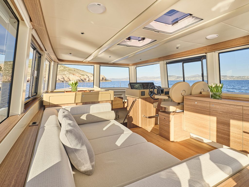 Omikron’s OT-60 yacht helm and saloon with coastal views.