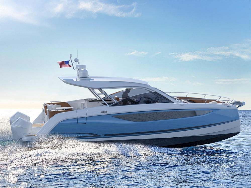 Four Winns TH38 twin-hull catamaran cruising at speed