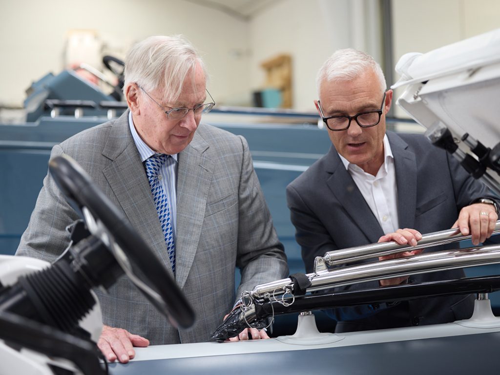 Duke of Gloucester being shown details on an Origin 57.