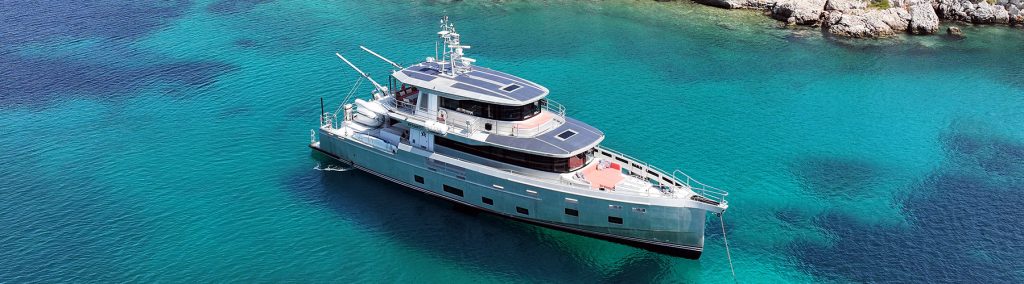 Aerial view of Arksen 85 sat on turquoise sea
