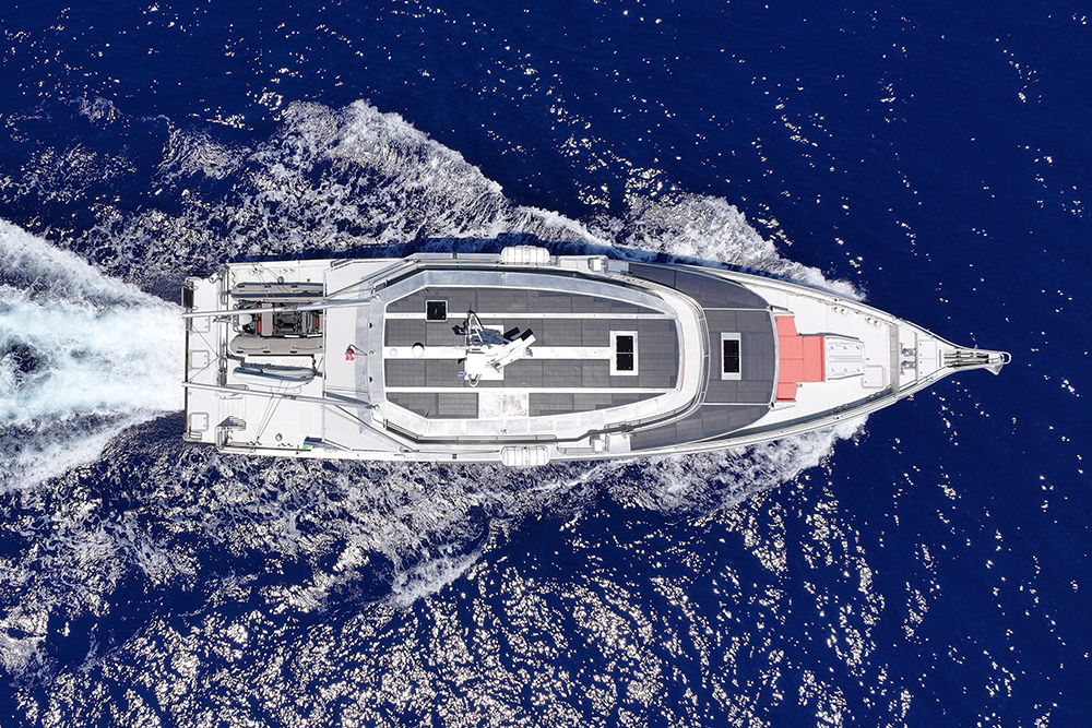 aerial view looking down on large vessel with solar panels to roof