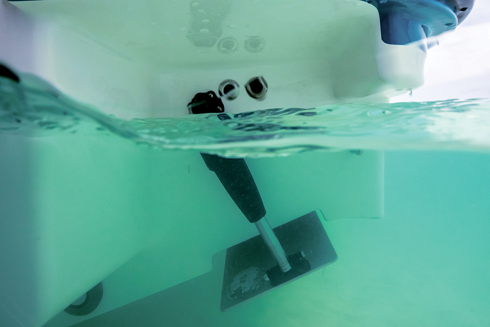 Underwater view of the Lenco trim tabs in green water