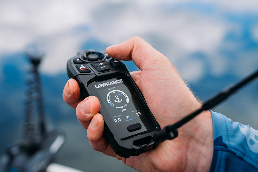 Hand holding a remote control for Lowrance Recon trolling motor