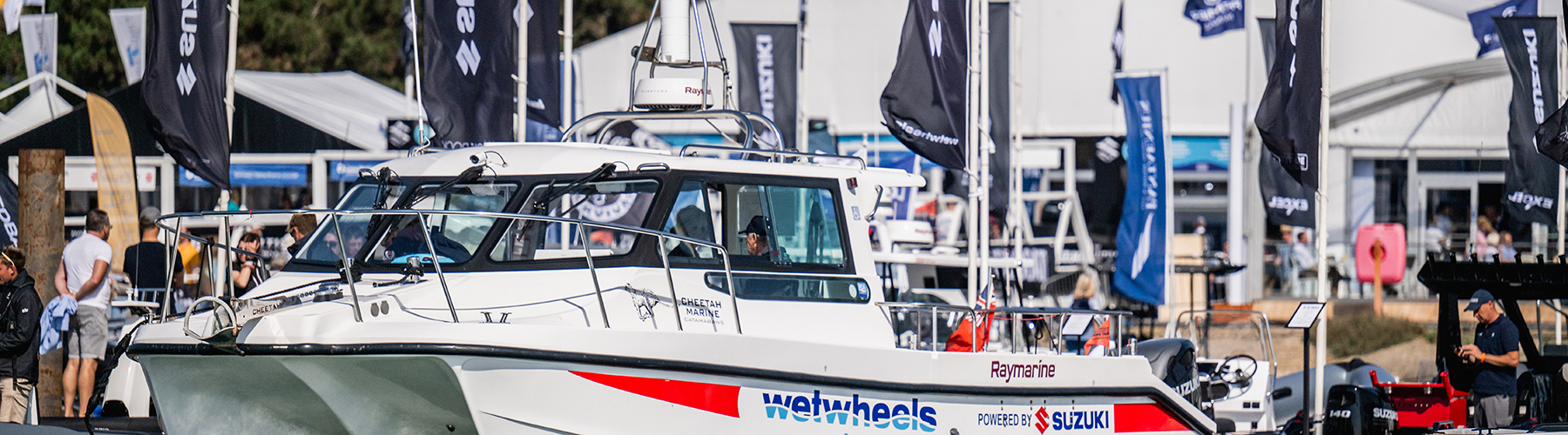 Wetwheels Solent Suzuki-powered catamaran displayed at Southampton International Boat Show marina.
