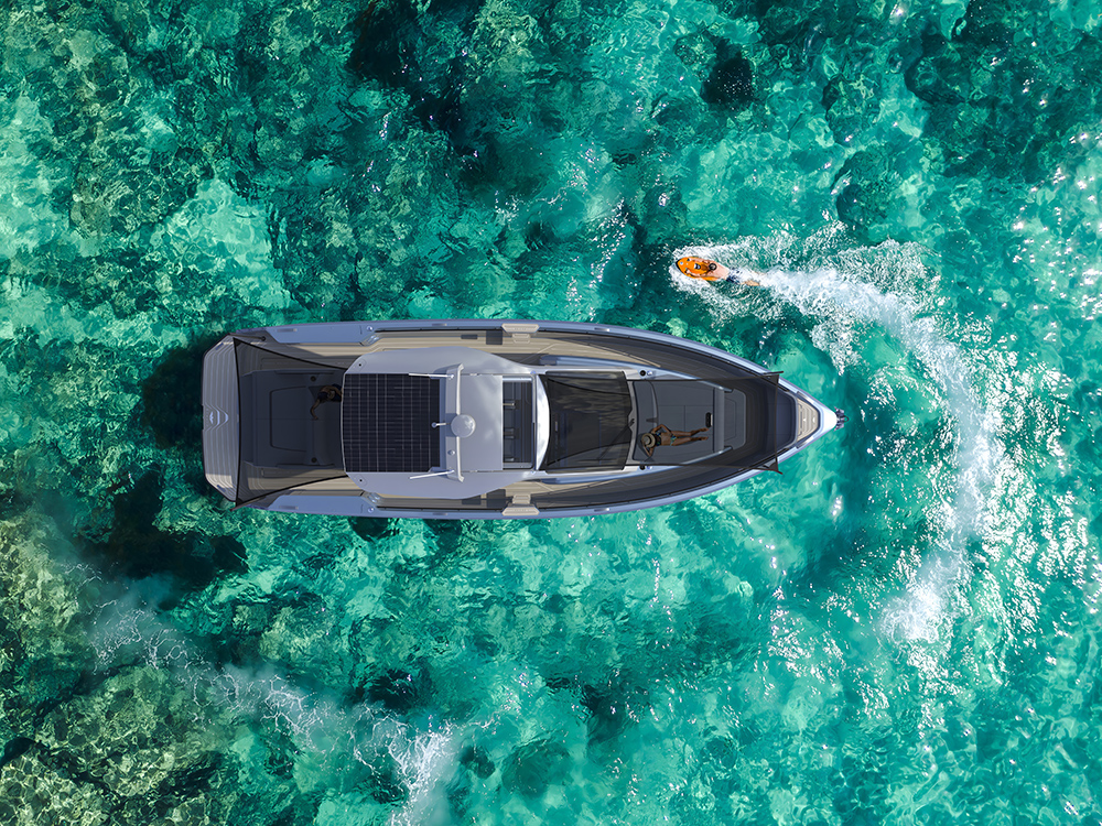 Aerial view of Sialia 45 electric yacht on clear turquoise water.