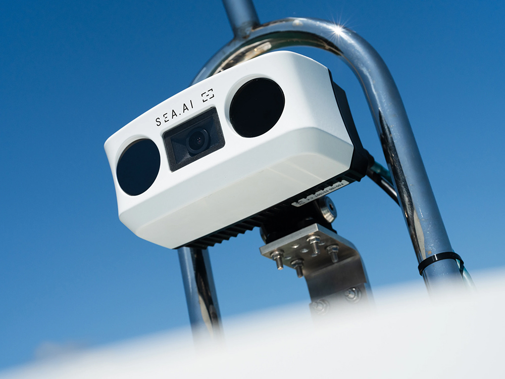 SEA.AI Watchkeeper collision avoidance camera in white mounted on boat structure.
