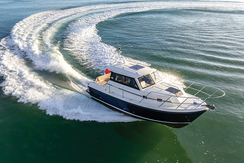 Orkney Pilothouse 27 underway turning a circle at sea creating a white frothy wake