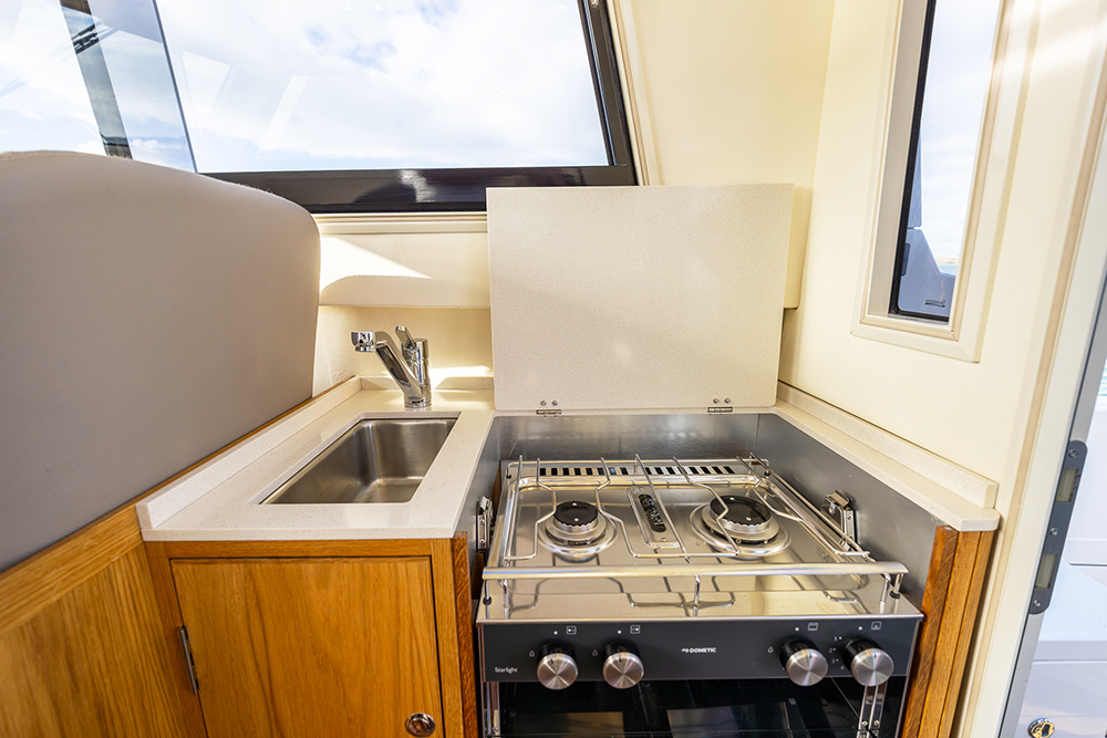 Upgraded galley showing cooker hob top and sink