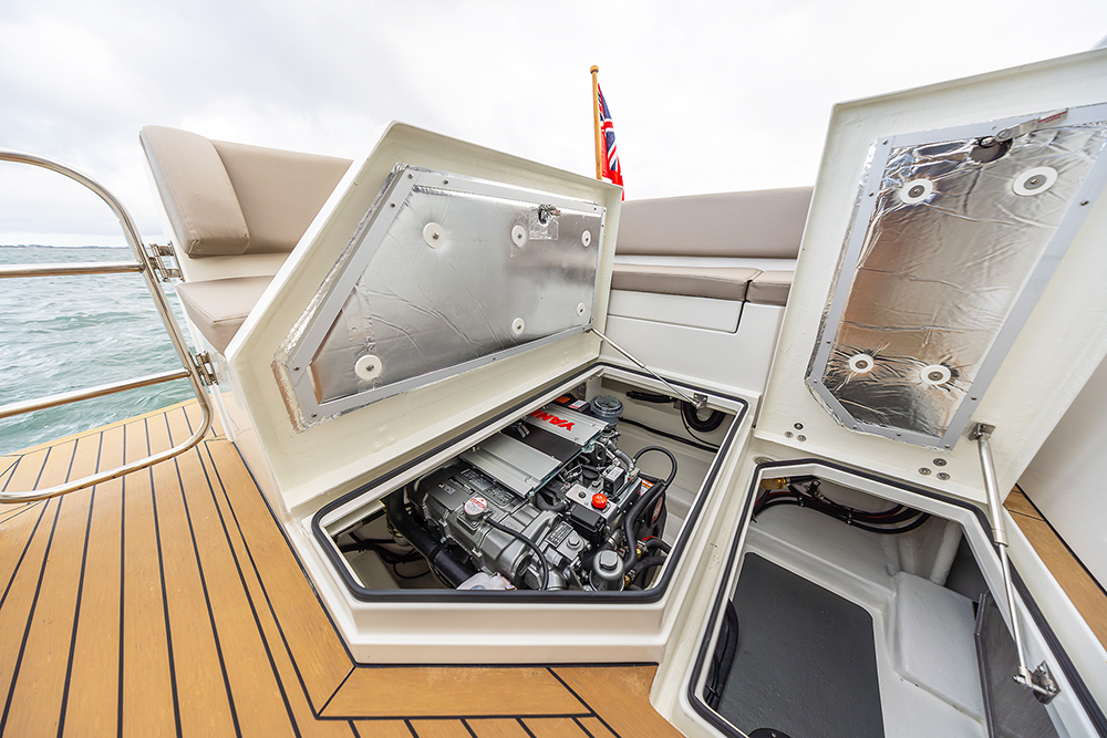 White lid lifting to show engine bay in Pilothouse 27