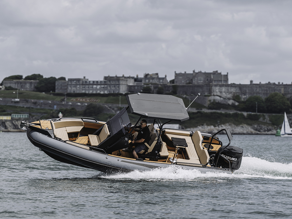 Aquaspirit Spirit 700 RIB powered by Suzuki outboard cruising at speed.