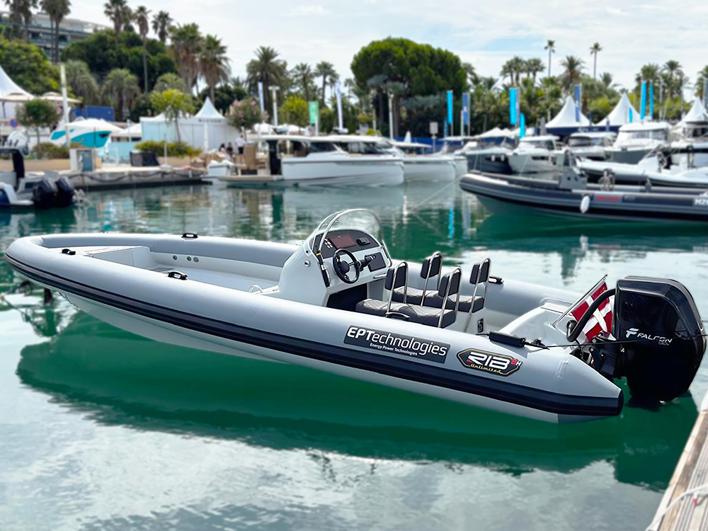 All-electric RIB Unlimited 8H powered by EPTechnologies Falcon outboard, displayed dockside at Cannes Yachting Festival.