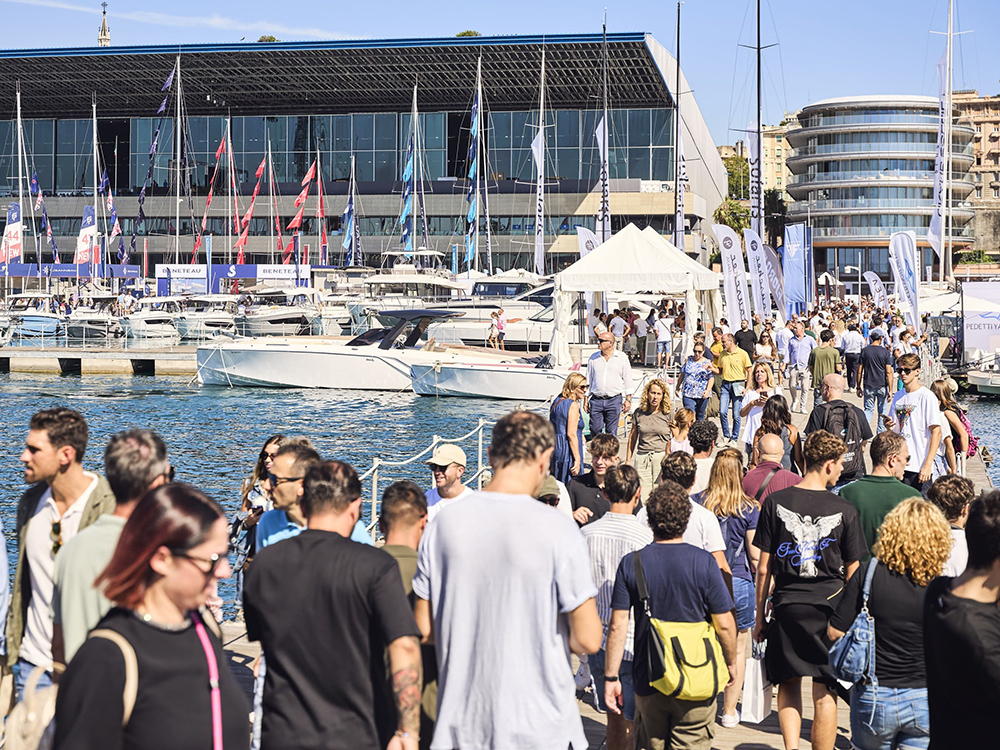 Crowds explore boats and yachts along the waterfront at the Genoa International Boat Show.