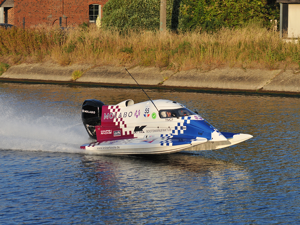 Molabo-powered electric Formula-4 race boat speeds along the Mons Water Grand Prix course.