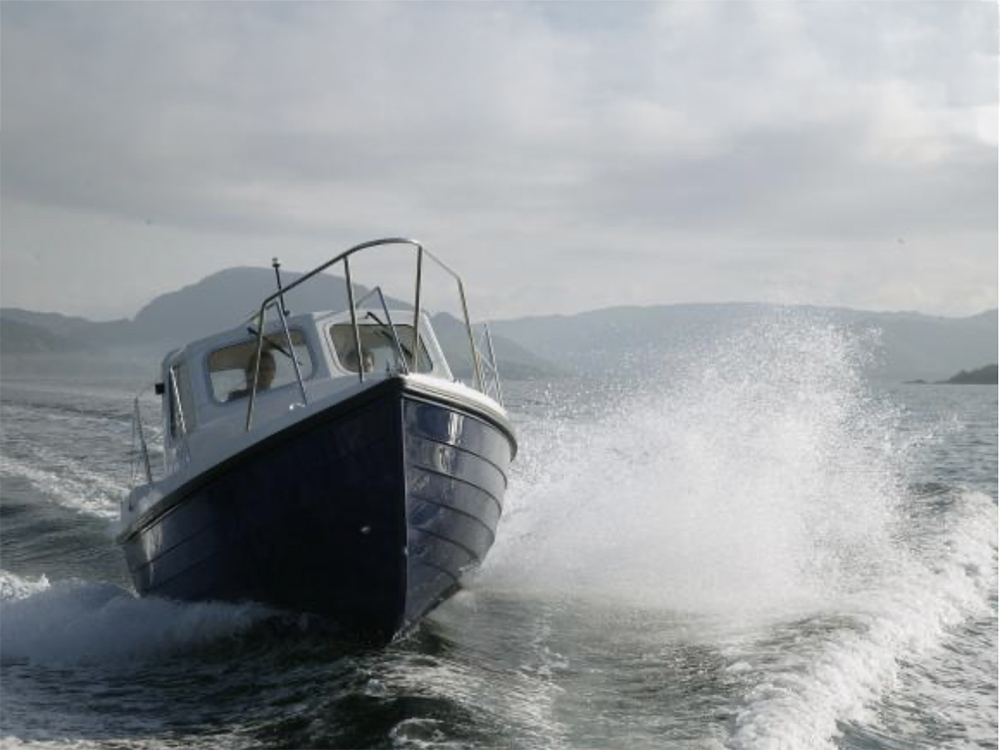 Orkney Dayangler 19+ MkII cruising at speed, against a coastal backdrop.