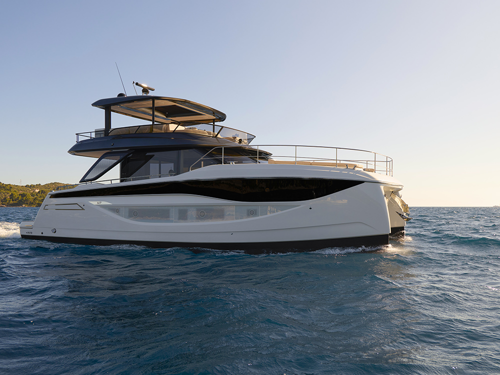 Prestige M7 luxury motor yacht cruising offshore in calm seas.