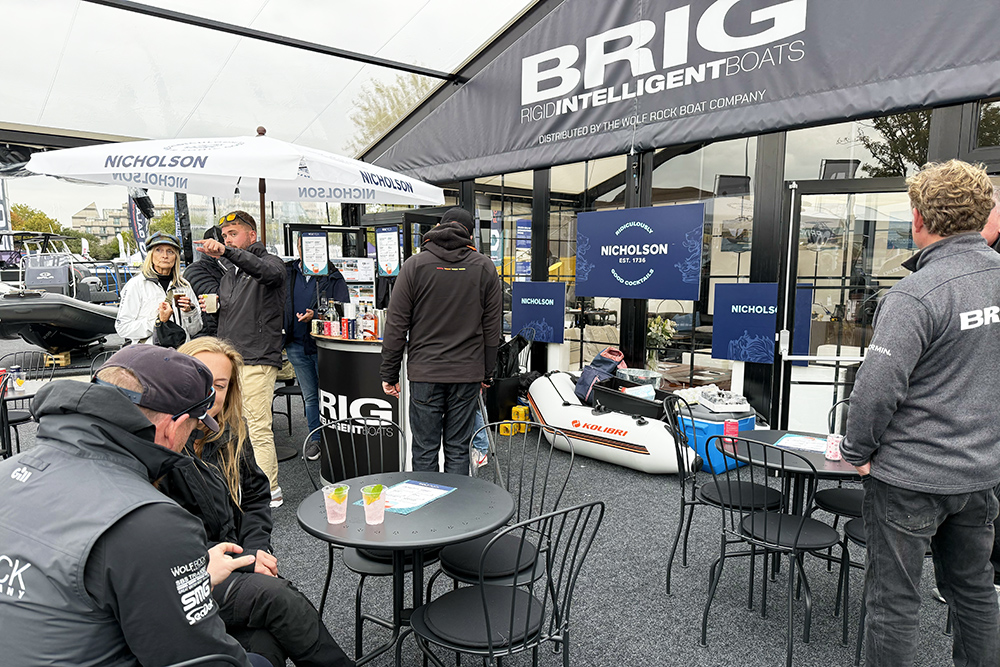 Brig RIBs stand at Southampton boat show with tables and chairs and entertainment area