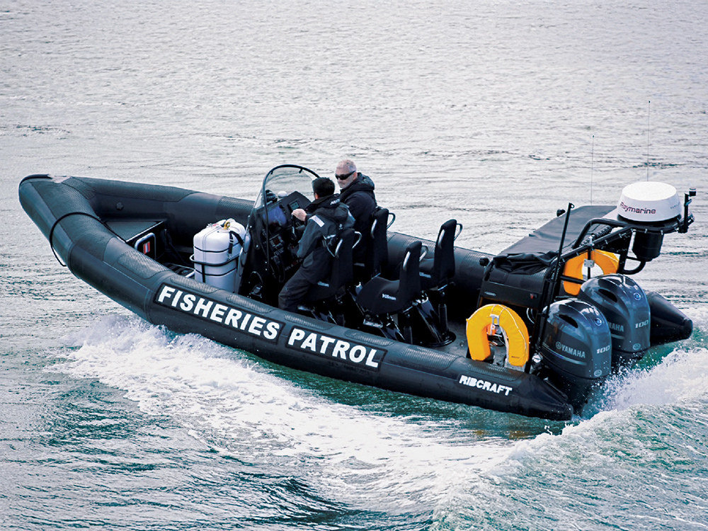 Ribcraft RIB powered by twin Yamaha outboards underway with crew on coastal waters.
