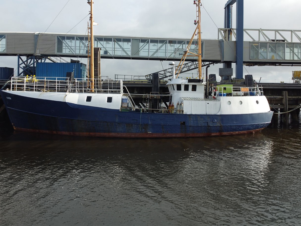 Dive support vessel Karin moored at a dockside in Orkney.