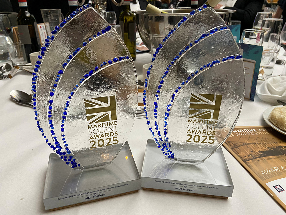 Two Maritime Solent Awards 2025 trophies on a dinner table, celebrating MDL Marinas’ wins for sustainability and clean maritime innovation.