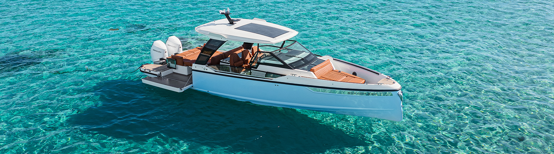 Saxdor 320GTO at anchor on beautiful turquoise sea with its rear sides folded out