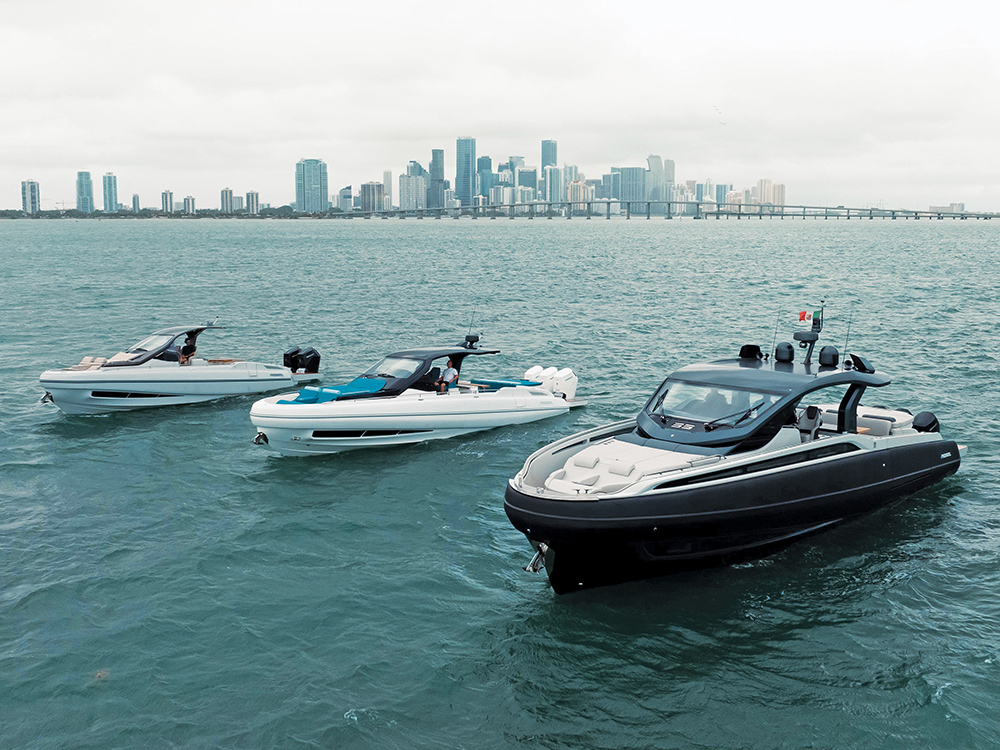 Three Sacs Tecnorib Rebel yachts cruising off the Miami skyline.