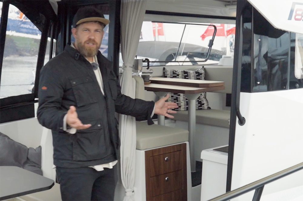 Monty giving a tour of the Finnmaster P8S pointing into the cabin