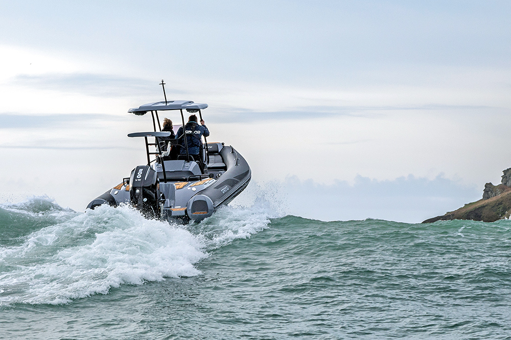 Rear view of the G680 RIB over the Salcombe bar, a lumpy sea.