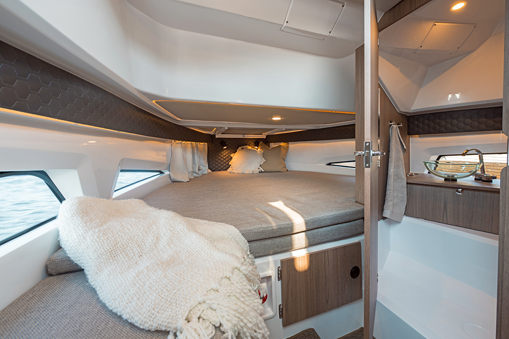 Nordkapp Enduro 830 cabin with blanket throw in foreground