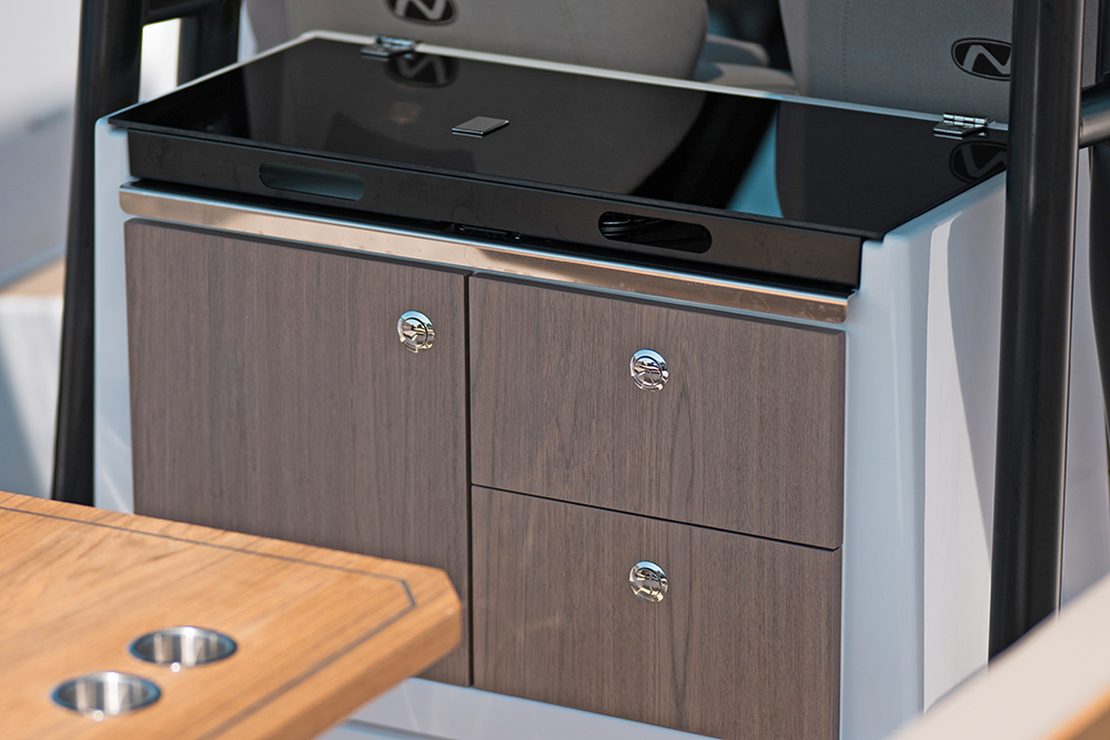 Nordkapp Enduro 830 galley unit with table in foreground and doors to the front