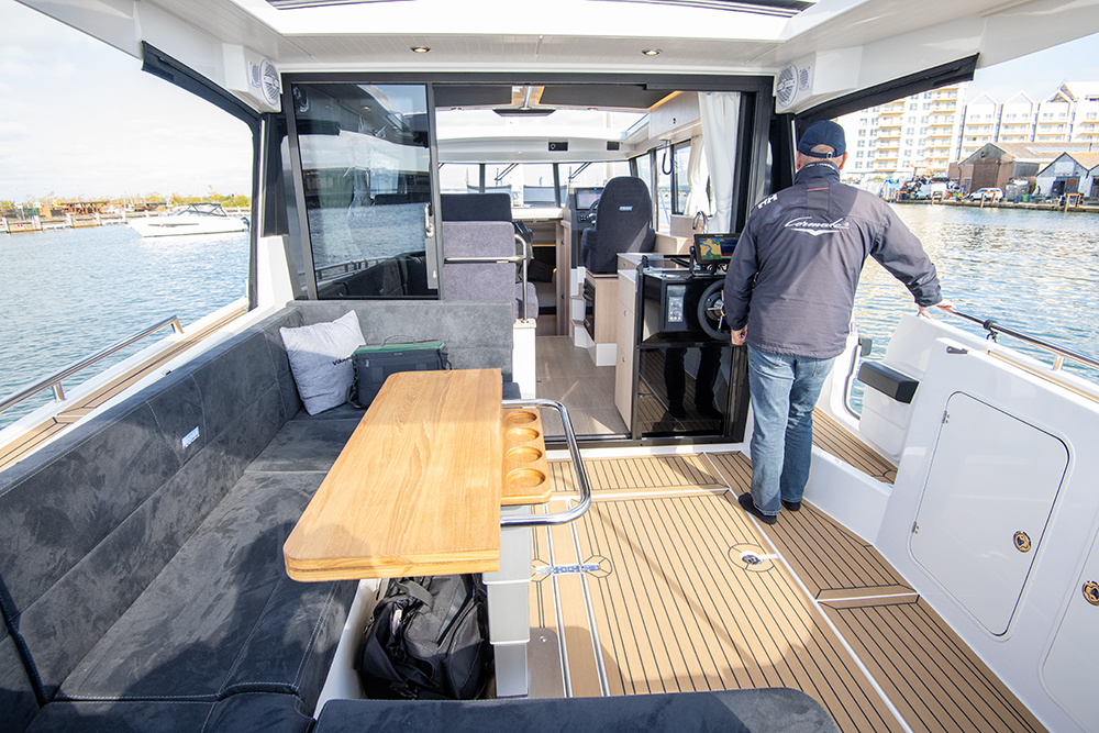 Aft cockpit area to Viknes 10 showing open tri-doors leading to saloon, also shows aft helm station