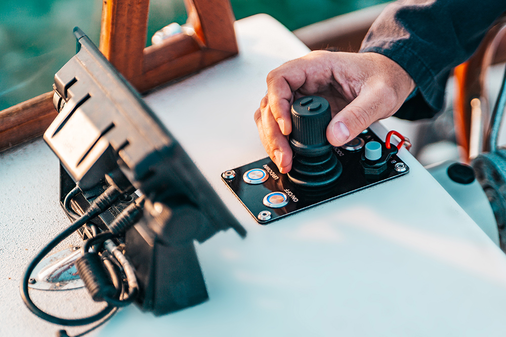BlueNav joystick control with a mans hand controlling it