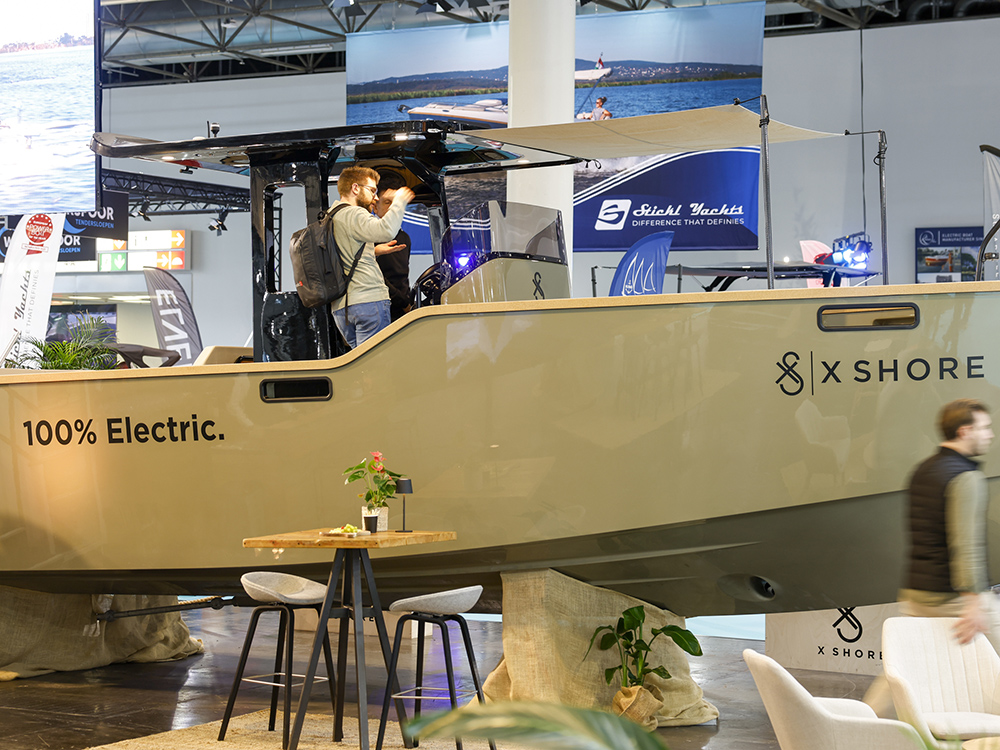 Visitors view an X Shore 100 percent electric boat on display at boot Düsseldorf.