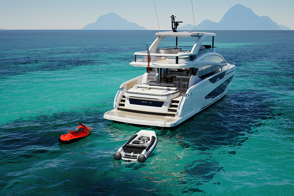 Pearl 73 at anchor with Riviera-style aft deck, fold-down balconies, tender and jet ski in clear turquoise water.