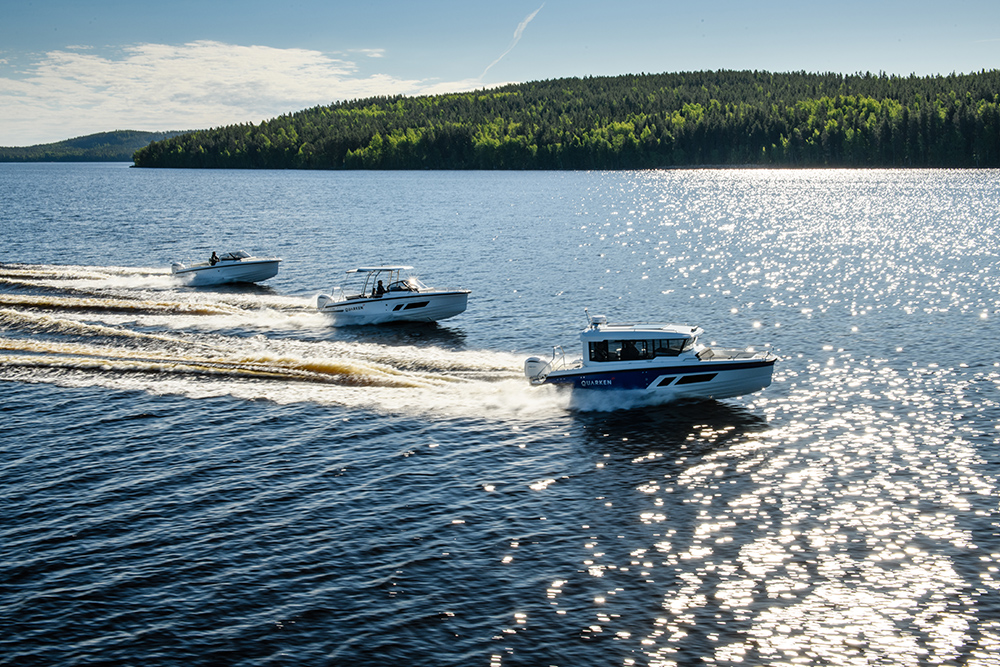 Three Quarken motorboats cruising at speed on open water, showcasing the 27 range in Nordic conditions with clean wakes and confident handling.