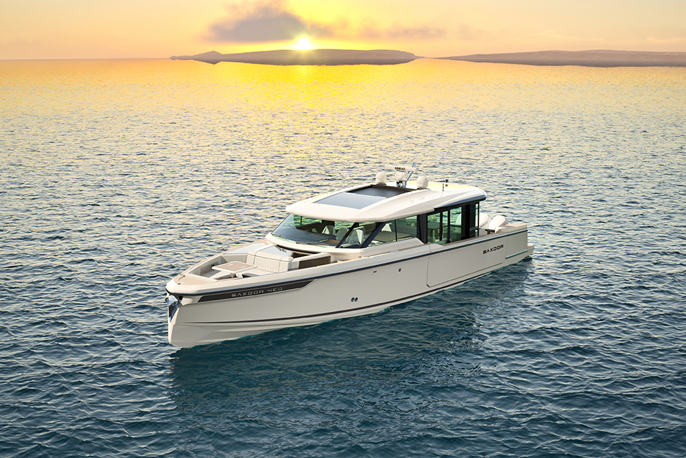 Saxdor 460 GTC cruising at sea at sunset, showing enclosed wheelhouse, walkaround deck and modern Scandinavian motor yacht design
