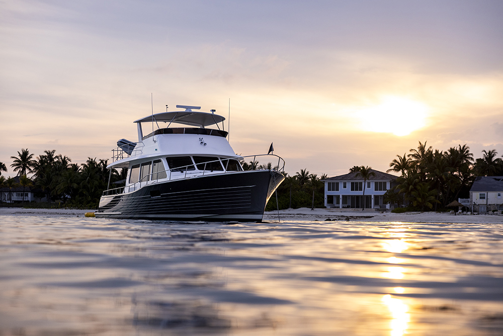 Grand Banks 62 moored at sunset, showing classic trawler styling, raised pilothouse and flybridge suited to long-range cruising.