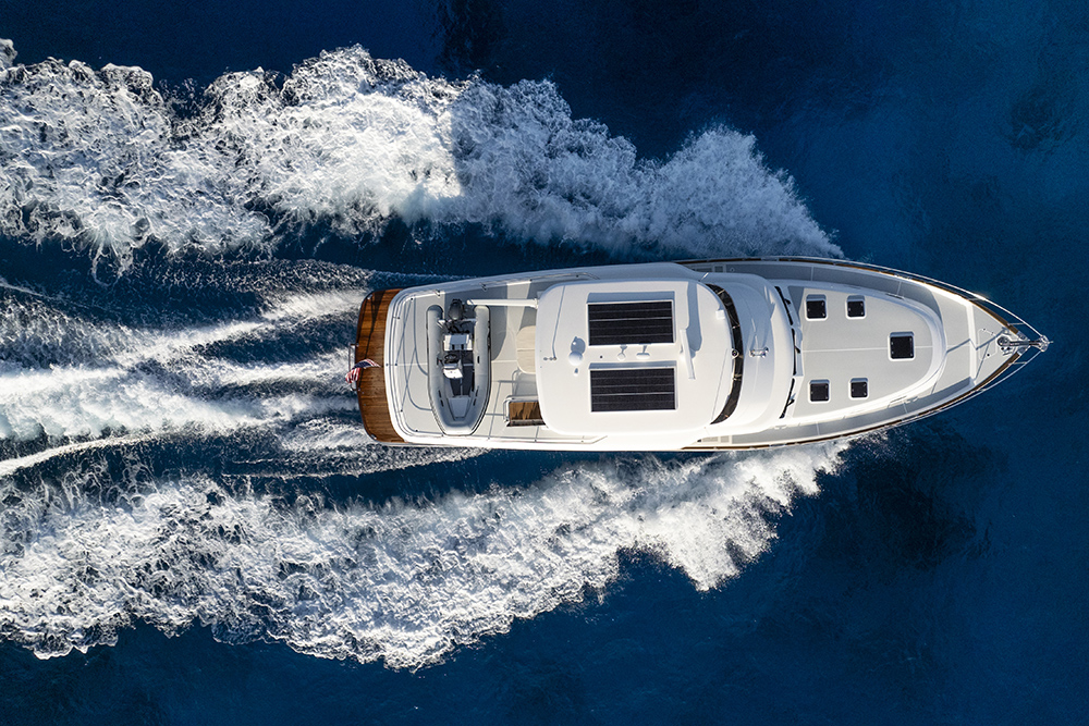 Aerial view of the Grand Banks 62 underway, showcasing its V-Warp hull, clean deck layout and efficient wake at cruising speed.