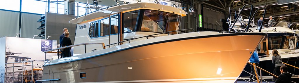 Targa 30.1 pilot house cruiser on display at Helsinki Vene Båt 2026, showcasing outboard setup and classic deck design.