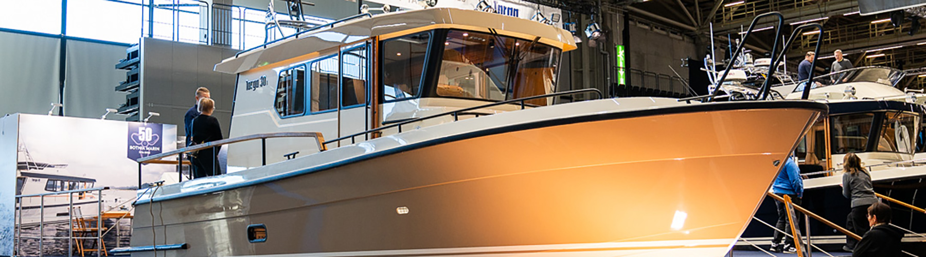 Targa 30.1 pilot house cruiser on display at Helsinki Vene Båt 2026, showcasing outboard setup and classic deck design.