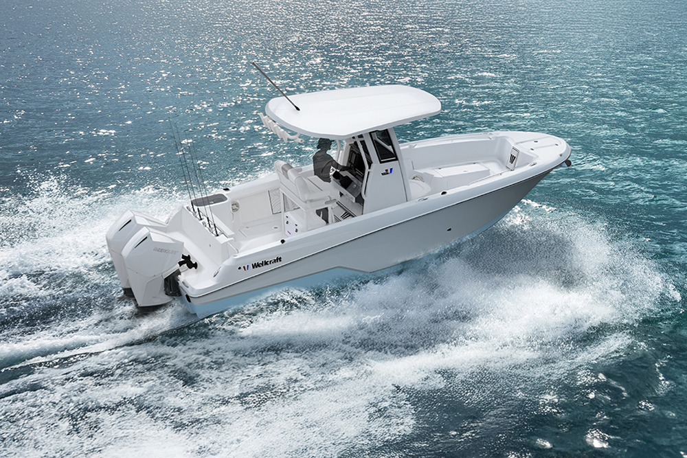 Wellcraft 243 Fisherman offshore centre console running at speed with twin outboards and T-top on open water