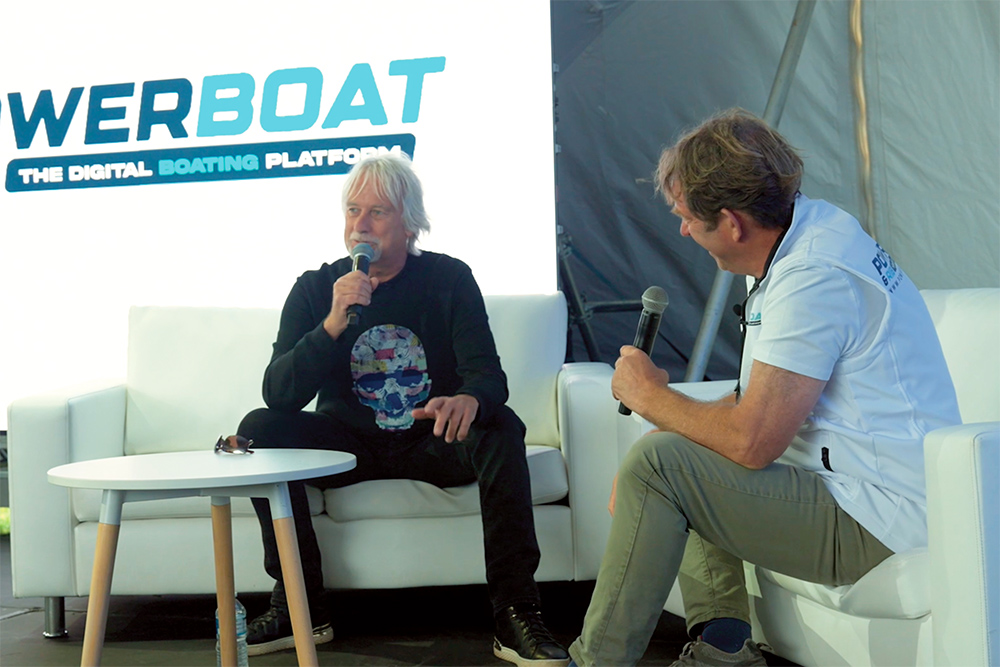 Miles Jennings sat with Hugo Montgomery-Swan on sofas with PBR logo on back screen