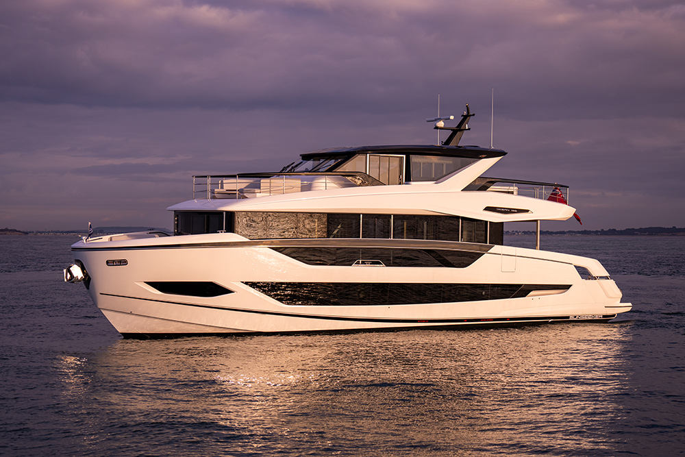 Sunseeker 82 Ocean enclosed motor yacht underway at sunset, highlighting expansive glazing and multi-deck luxury design.